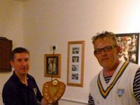 Adam receiving the winners trophy